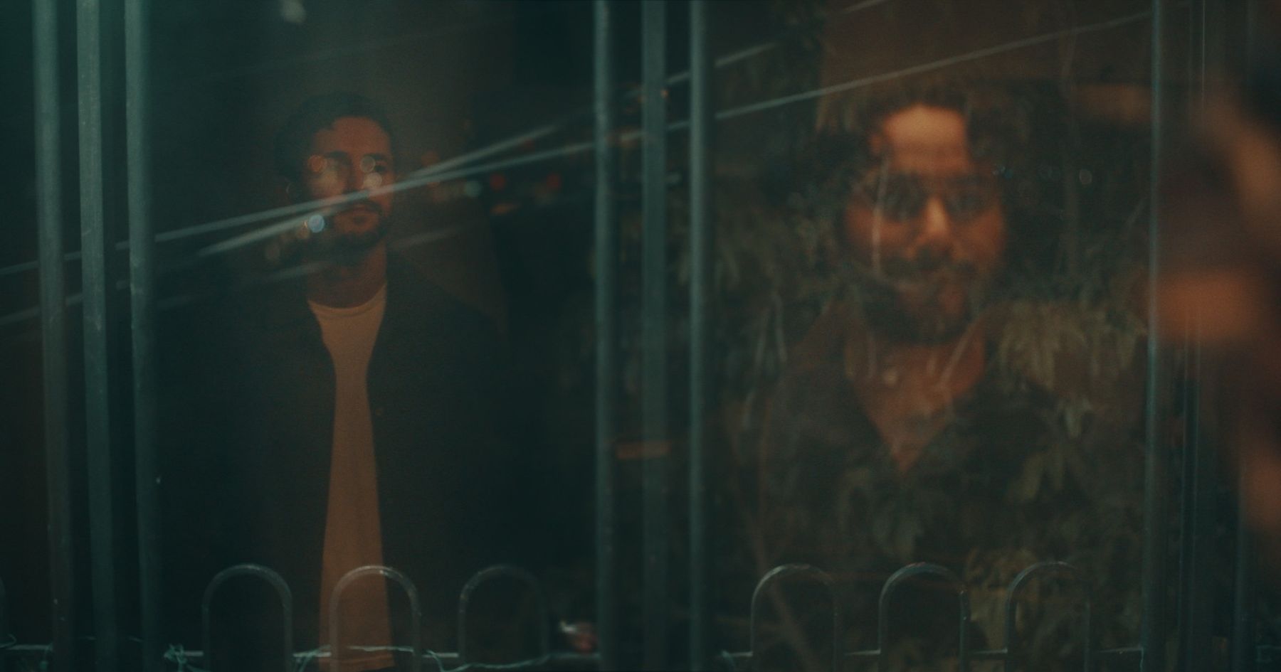 Lex and Milo seen through glass and reflection
