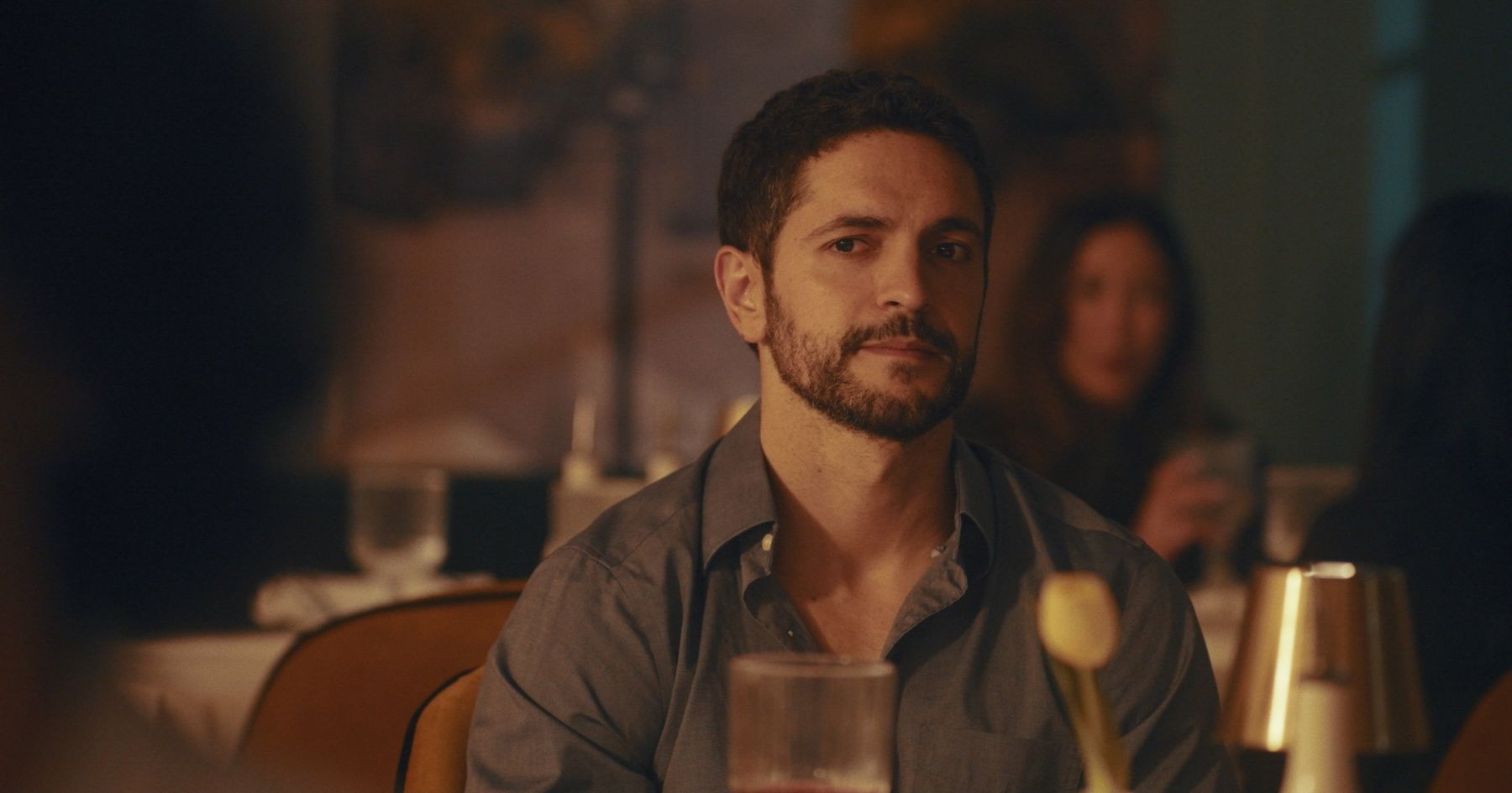 lex at the table, looking across